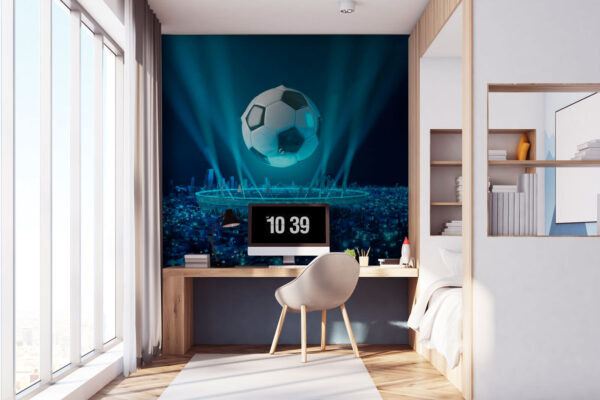 Plutind mingea de fotbal peste oraș luminat Fototapet Plutind mingea de fotbal peste oraș luminat