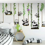Fototapet Grup de panda pe leagăne