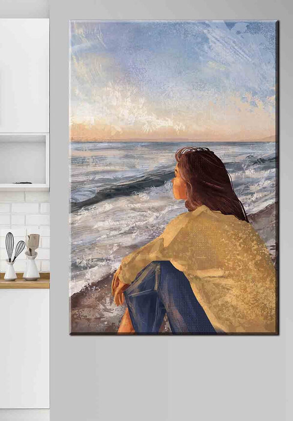 Femeie stând pe o plajă cu vedere la ocean Tablouri Femeie stând pe o plajă cu vedere la ocean