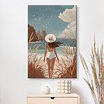 Tablou pe pânză O femeie în costum de baie și cu pălărie, plimbându-se pe plajă