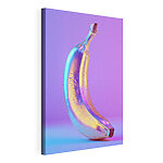 Tablou pe pânză O banană colorată pe un fundal violet