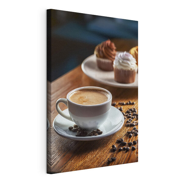 Ceașcă de cafea și cupcakes pe o masă Tablou pe pânză Ceașcă de cafea și cupcakes pe o masă